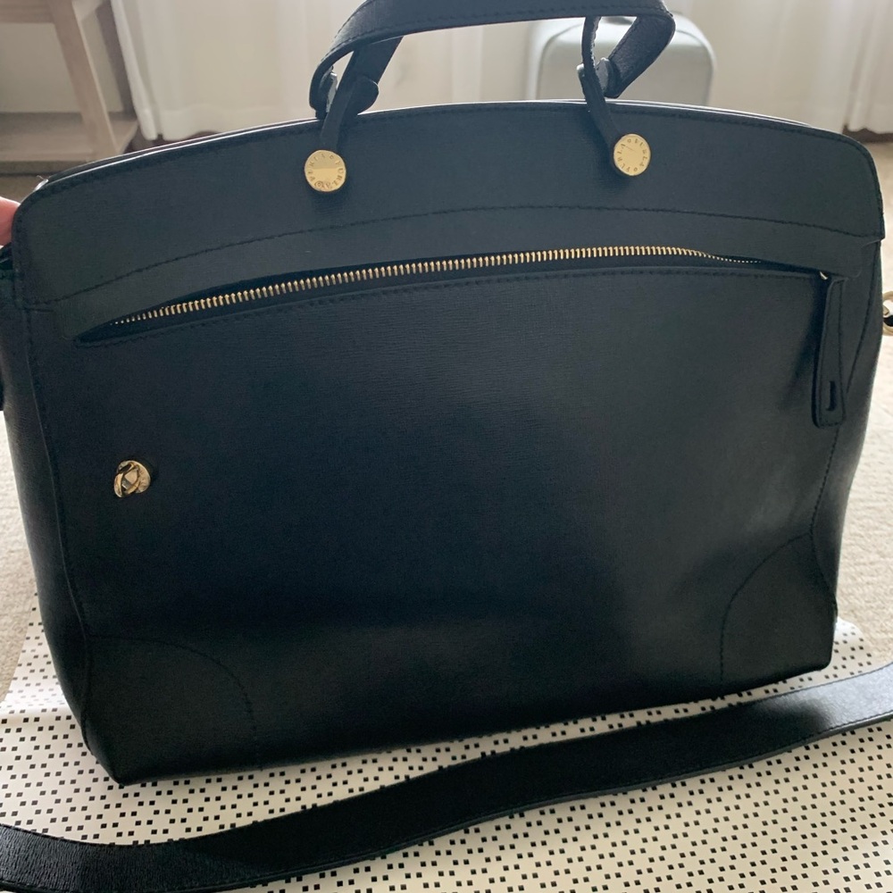 Measures 15x12x5 inches. Double handle and removable shoulder strap.